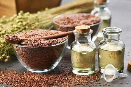 Linseed oil bottles, flax seeds bowl, a Food & Drink Photo by chamillewhite
