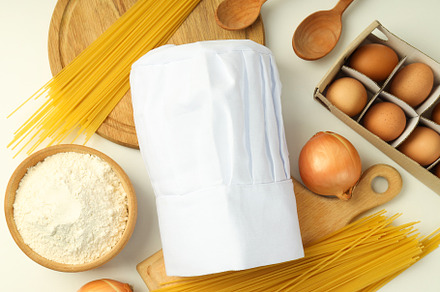 Composition with chef hat for concept of cooking, top view, a Food & Drink Photo by AtlasStudio PRO