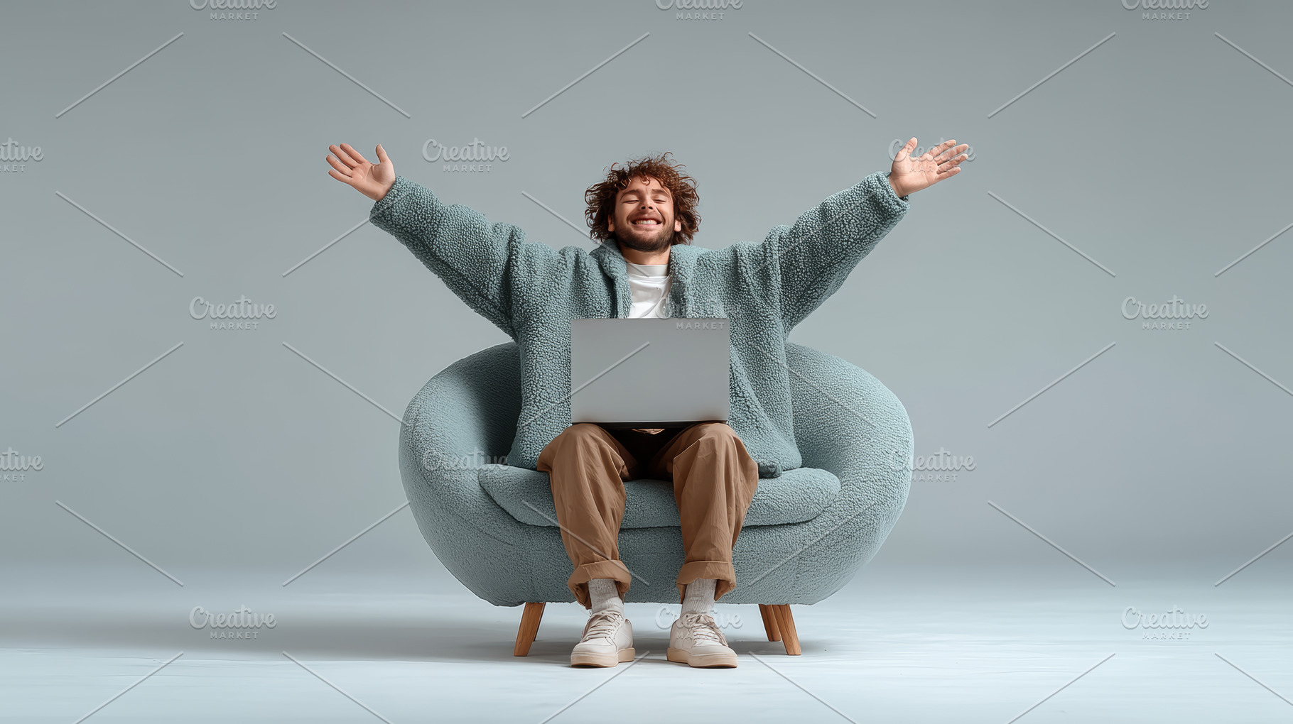 Young man cheering while using a laptop in a comfortable chair, a Photo by AS photostudio