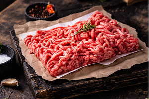Raw minced meat on dark background, a Food & Drink Photo by Yulia Furman