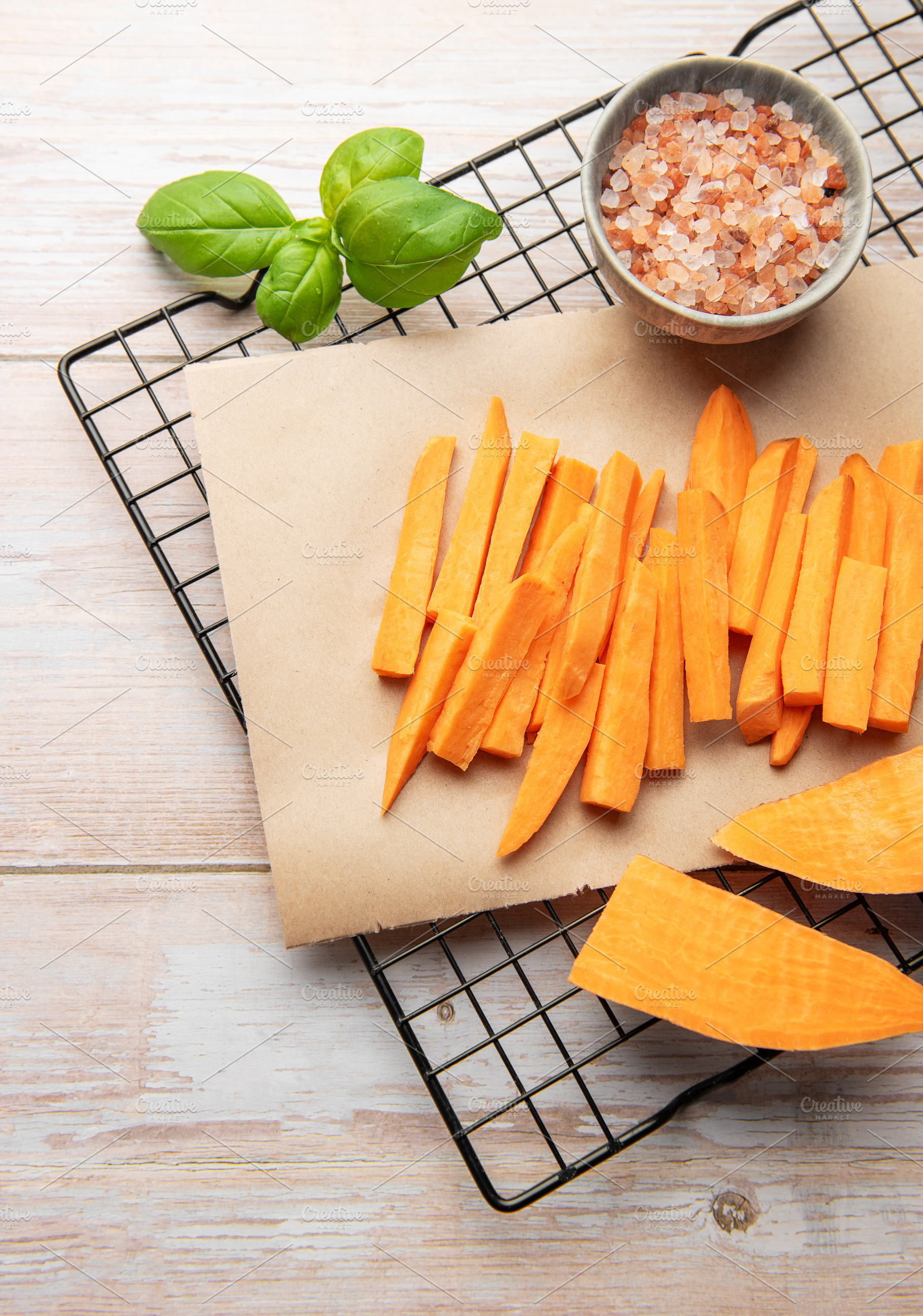 Preparing raw sweet potato fries for healthy cooking, a Food & Drink Photo by Olena Rudo