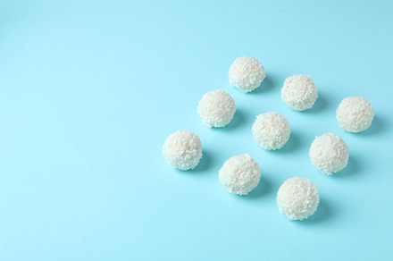 Concept of tasty sweets, coconut candies, space for text, a Food & Drink Photo by AtlasStudio PRO
