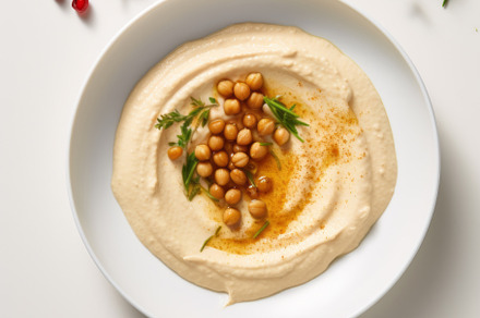 Classic hummus with herbs, olive oil in a vintage ceramic bowl flat lay, a Food & Drink Photo by Natalia Klenova's Shop