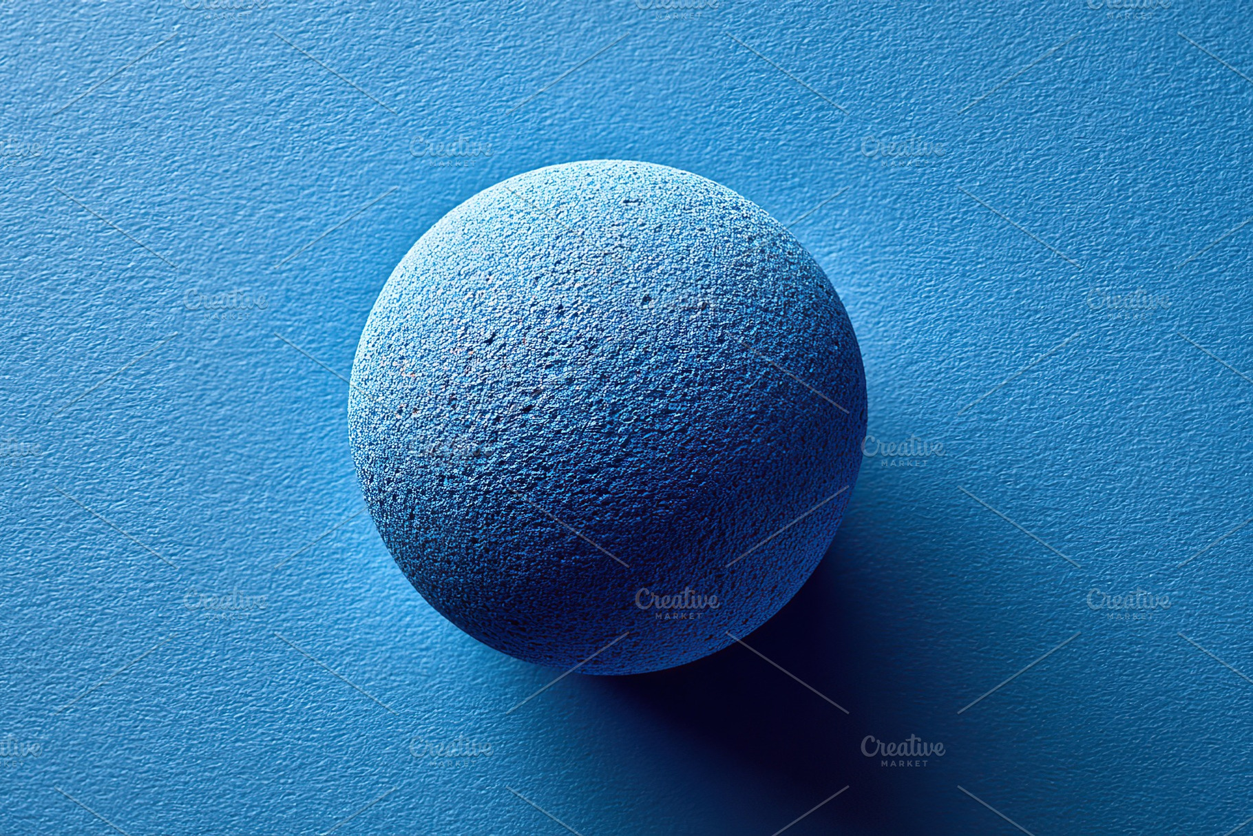 Vibrant cobalt sphere presented on a smooth blue surface in a flat lay arrangem, a Photo by AlyaAnd