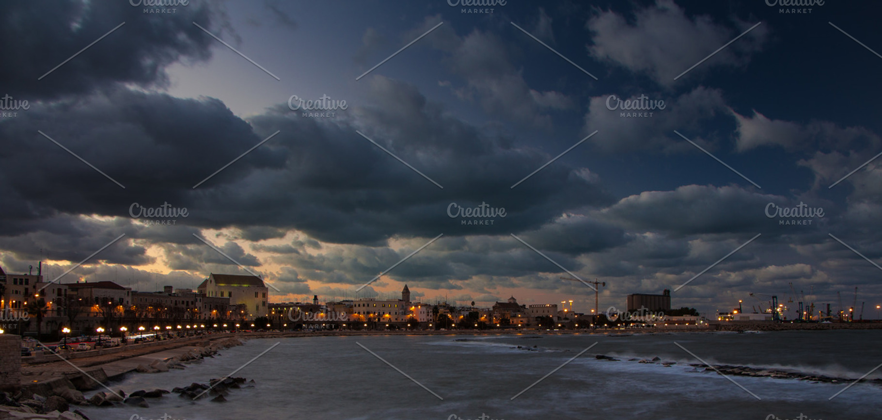 Bari with stormy clouds at sunset featuring bari, cityscape, and city, an Architecture Photo by Travel_photos