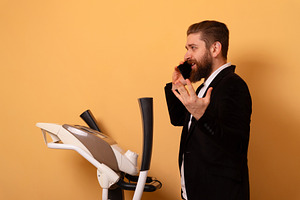 Businessman on Treadmill Call, a Person Photo by Ales Munt