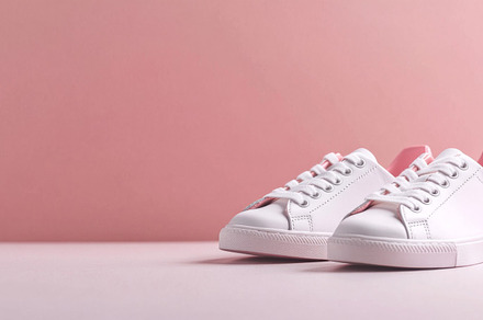 Pink sneakers on color background, a Photo by Dvoevnore photos