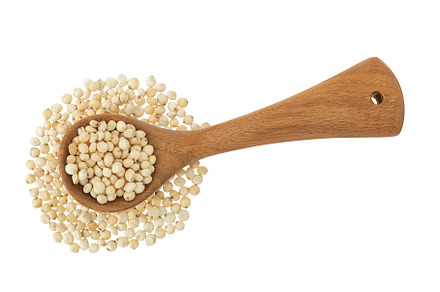 Sorghum seeds in wooden spoon, a Food & Drink Photo by NataPhoto