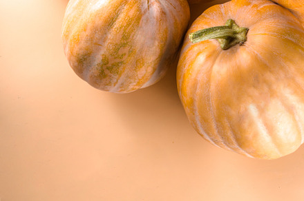 Autumn pumpkins on beige autumn background, a Food & Drink Photo by Rimma