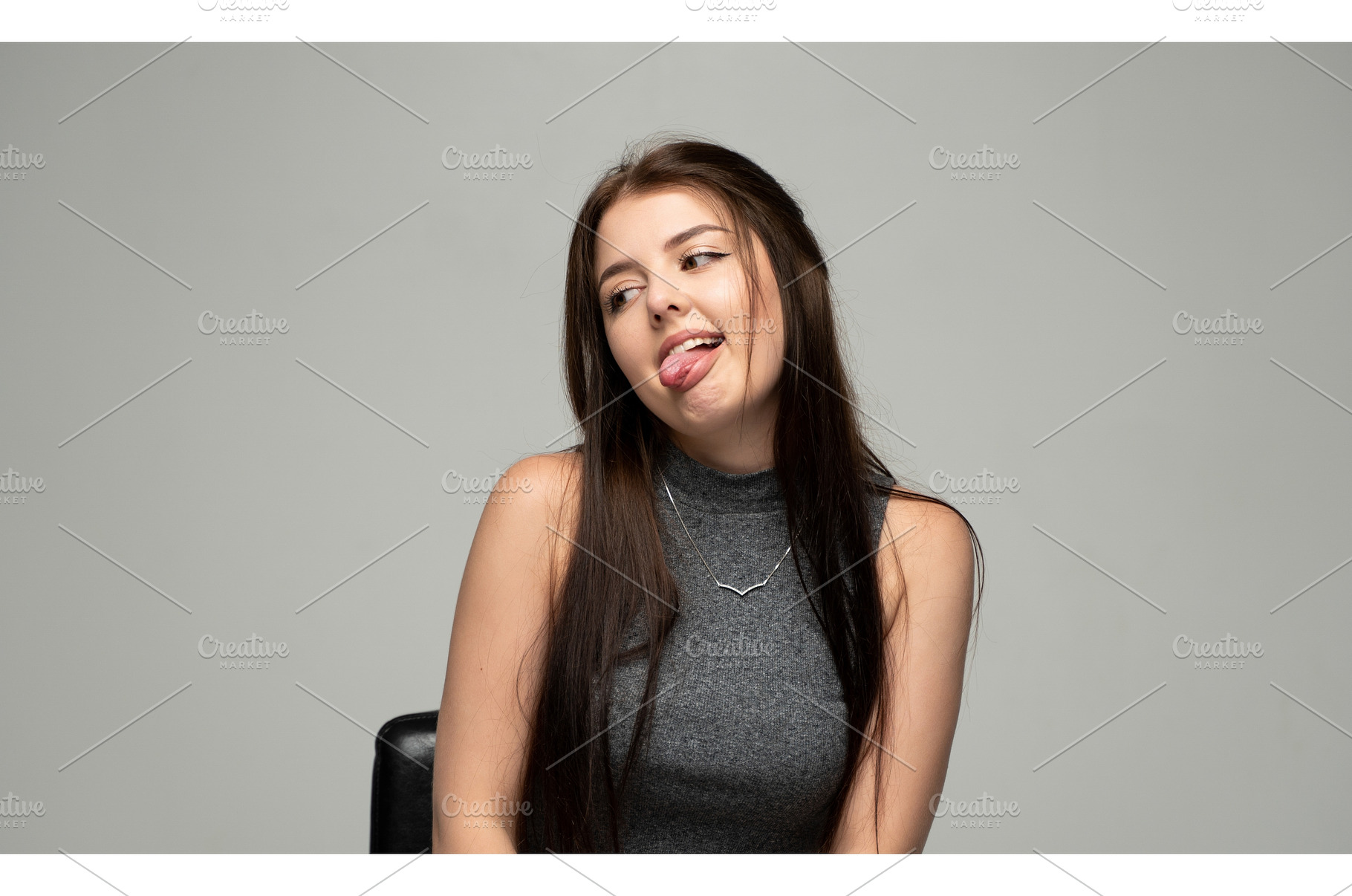 Young brunette woman making a funny, a Person Photo by volodymyrshtun13795