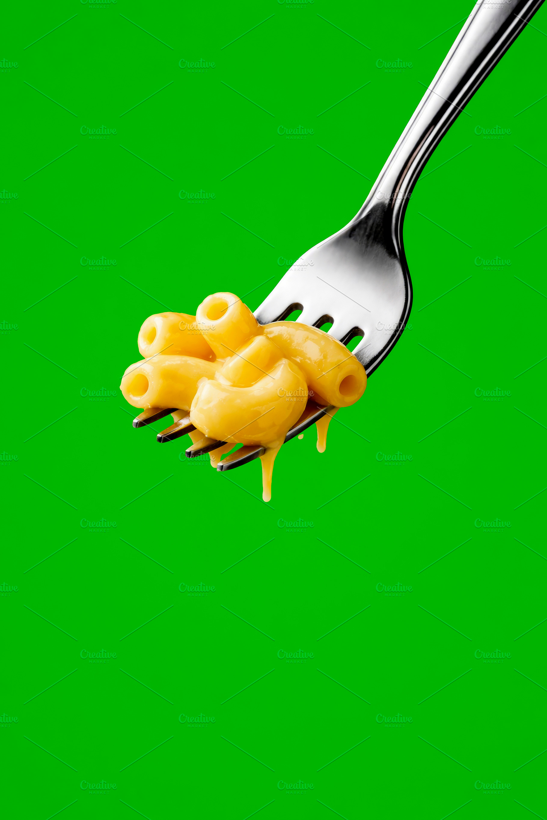 mac and cheese on a fork over green, generative AI, a Photo by Nito