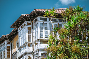 White balconies with red tile roof, an Architecture Photo by SkyNext