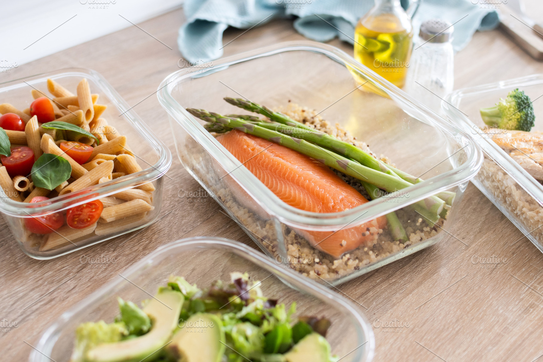 Healthy meal prep containers with salmon, chicken, pasta and fresh vegetables, a Food & Drink Photo by etorres69