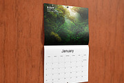 Saddle Stitched Wall Calendar Mockup, a Mockup by Vectogravic Design (Thumbnail 1 of 7)