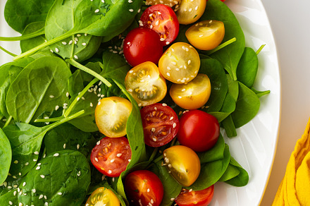 Salad with tomatoes and spinach, a Food & Drink Photo by Pandateam