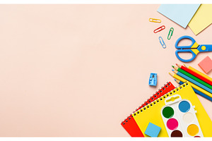 School supplies on colored