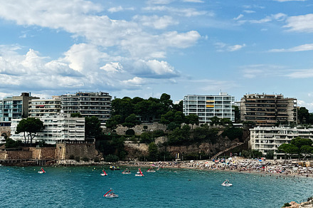 Picturesque Coastline with Beach and Modern Buildings in Tarragona, Spain, a Photo by AS photostudio