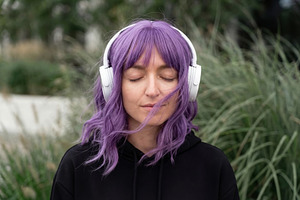 Young Woman Wearing White Headphones, a Person Photo by Virgo Studio