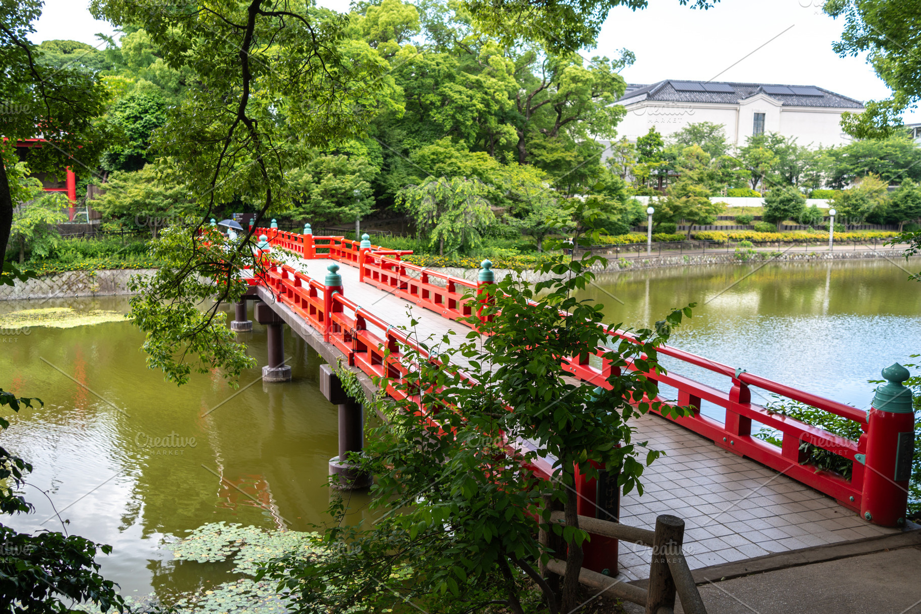 Red bridge over Kawazokoike pond in Tennoji Park, Osaka, an Architecture Photo by GoodGoods