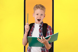 Excited Schoolboy In Smartphone Screen Having Idea, Yellow Background, a Photo by Prostock-Studio