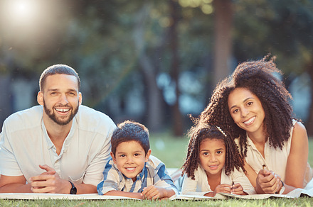 Relax, picnic and happy family rest together in a park, having fun and bonding on grass together. Love, smile and portrait of cheerful parents enjoy time in nature with excited kids, smiling kids, a Photo by Peopleimages.com