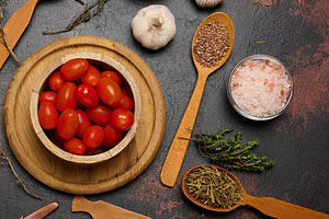 Spices in spoons and bowls on a dark background. Cooking ingredi, a Food & Drink Photo by ndanko