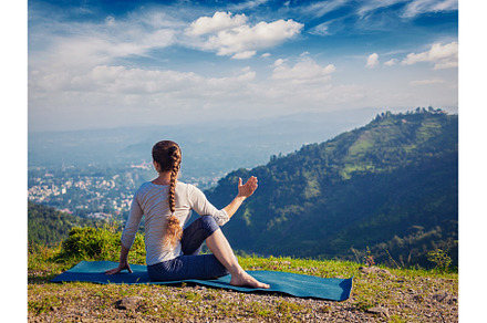 Woman practices yoga asana outdoors, a Sports & Recreation Photo by f9photos