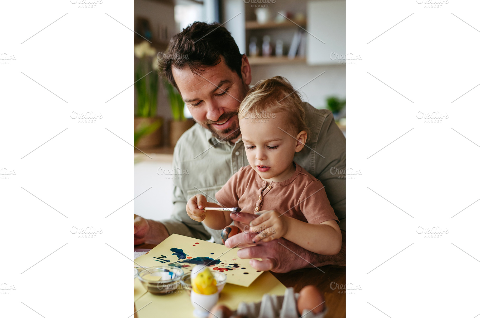Father and little son decorating, a Holiday Photo by HalfPoint