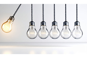 Row of light bulbs with one glowing, a Technology Photo by Igor Tichonow