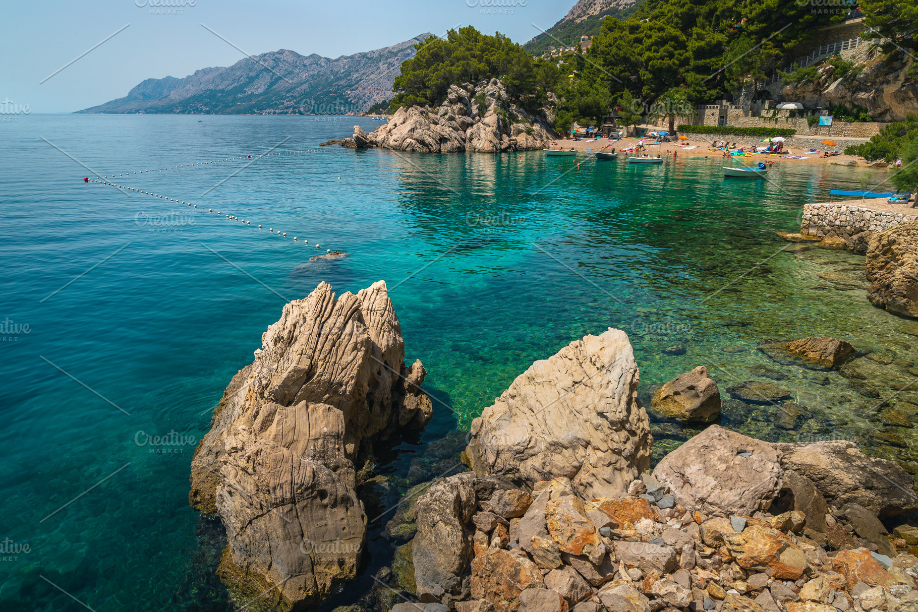 Stunning beach and moored boats, a Nature Photo by Alpine Dreams