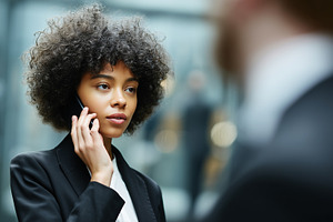 Businesswoman in afro hair talking, a Business Photo by MistyDay