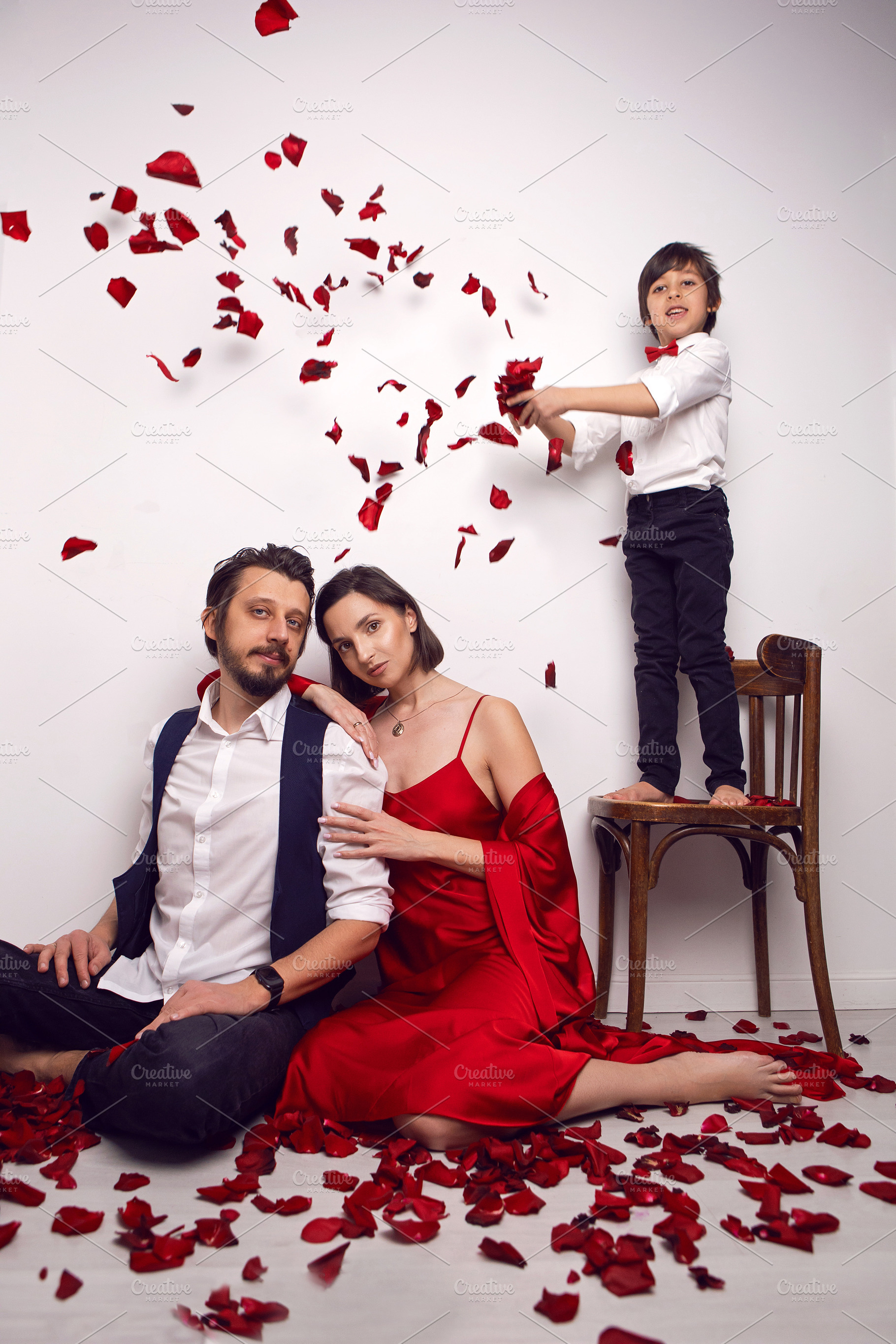 couple of lovers are sitting on the floor in an apartment against a white wall, a Person Photo by SaulichPhoto