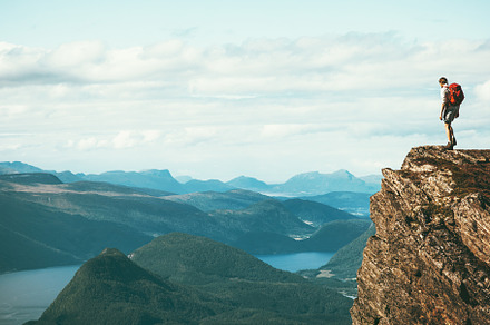 Man explorer standing on cliff alone, a Sports & Recreation Photo by e v e r s t