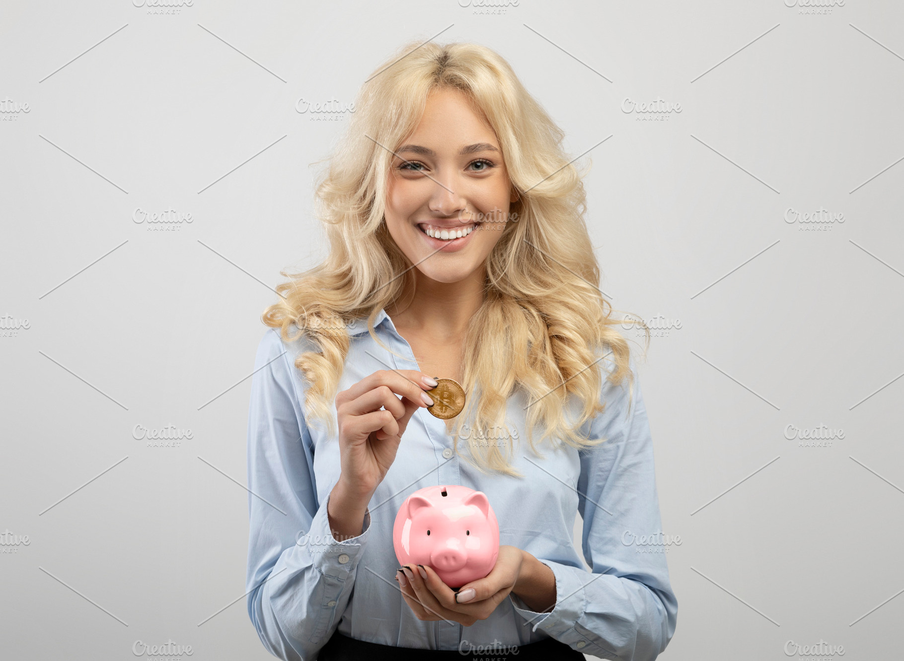 Excited businesswoman investing in bitcoins, putting golden crypto coin into pi, a Photo by Prostock-Studio