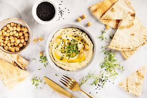 Creamy Hummus with Pita Bread and Black Sesame Seeds, a Food & Drink Photo by Natalia Klenova's Shop