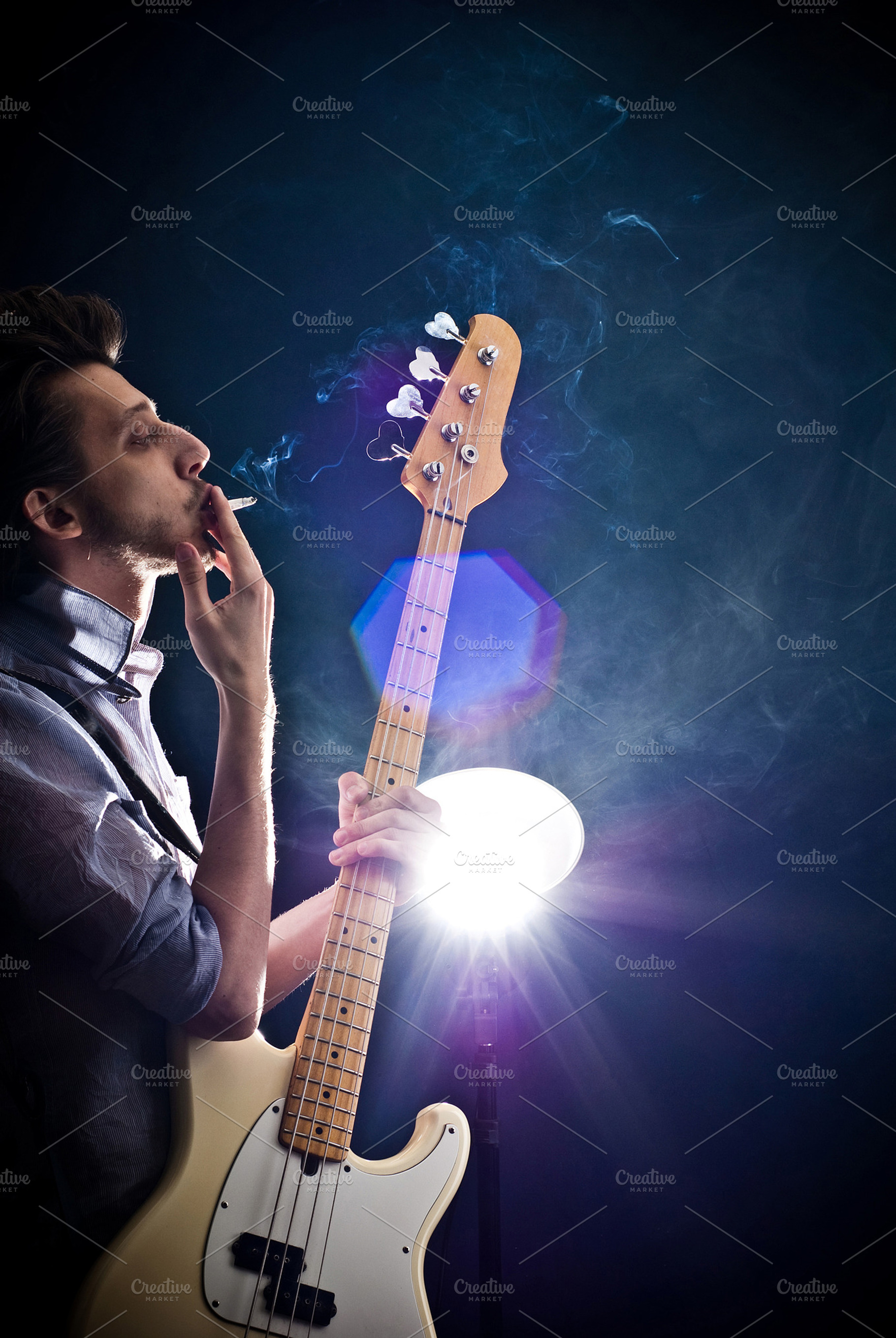 Man with a guitar stock photo containing studio and guy, a Beauty & Fashion Photo by SaulichPhoto