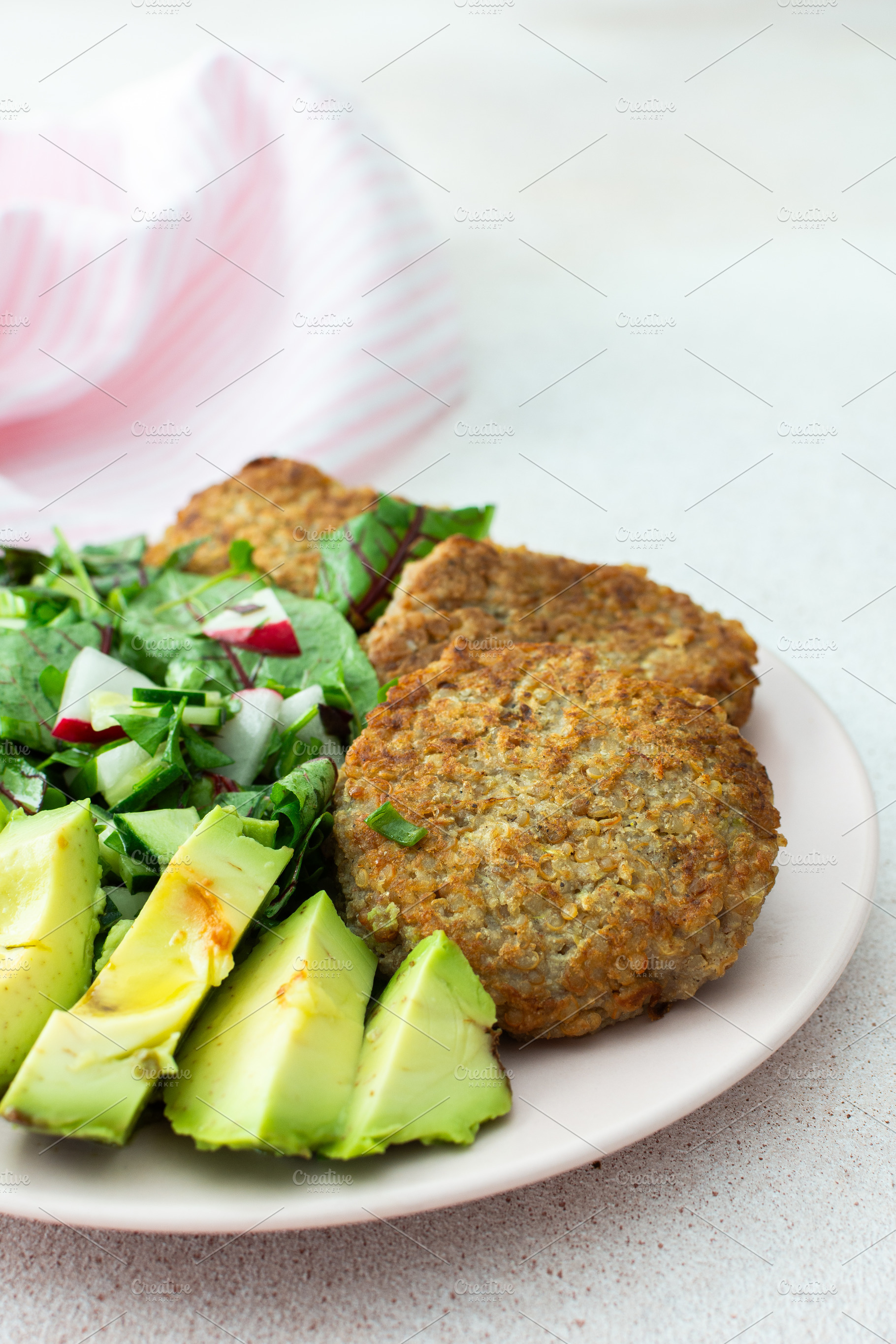 Quinoa cutlets and mixed salad, a Food & Drink Photo by Pundateam