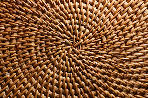 Wicker rattan craft showing intricate woven texture and natural, a Photo by Studio ANNA