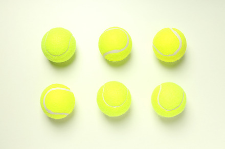 Flat lay with tennis balls on white background, a Sports & Recreation Photo by AtlasStudio PRO