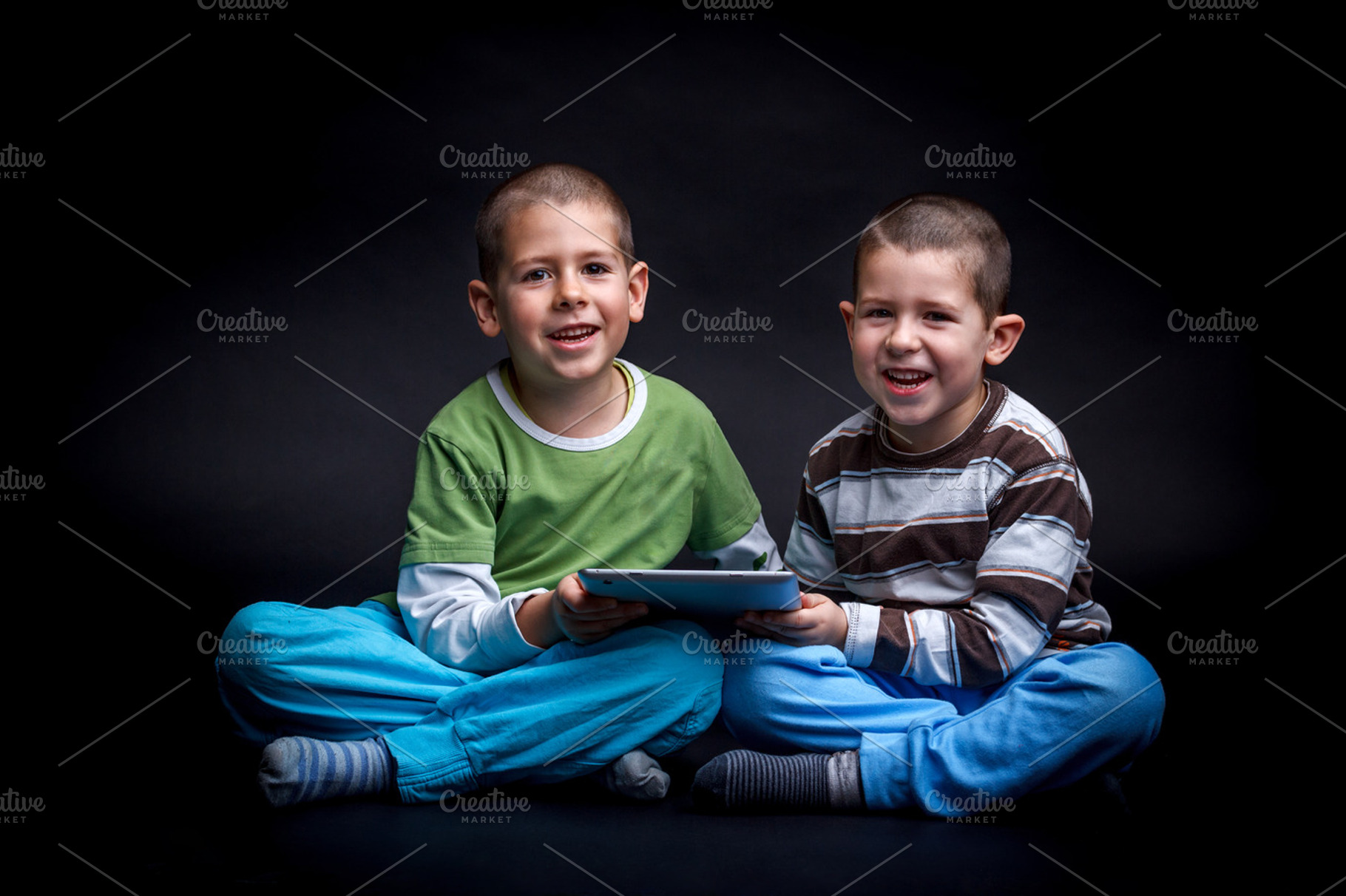 Children Using Electronic Tablet Featuring Black Background Boy And Brother