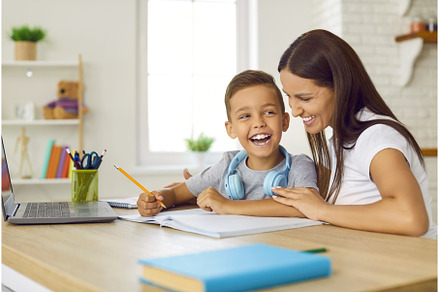 Joyful preschooler boy is studying