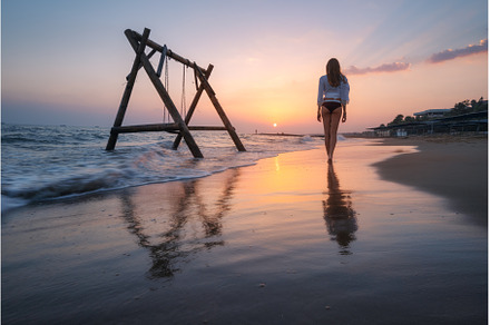 Young woman near wooden swing in, a Person Photo by den-belitsky