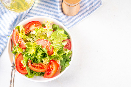 Vegetable salad with lettuce and sliced tomatoes, a Photo by Rimma
