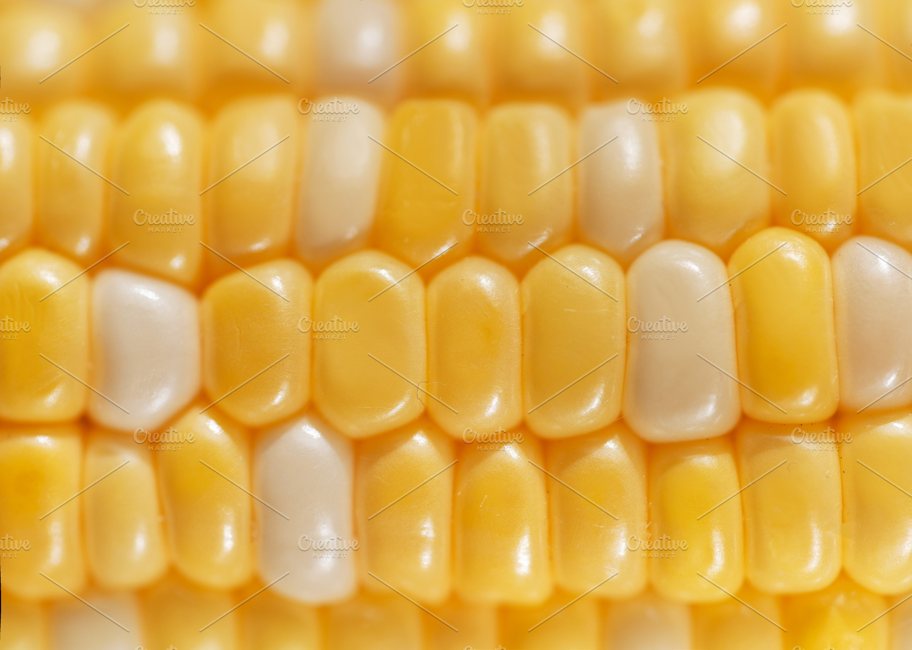 Close up of vibrant sweet corn kernels, a Food & Drink Photo by Olena Rudo