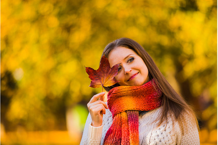 Woman in scarf hided with a maple, a Person Photo by oksix