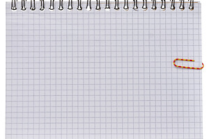 A sheet of squared paper from a spiral-bound notebook with a col, a Business Photo by ndanko