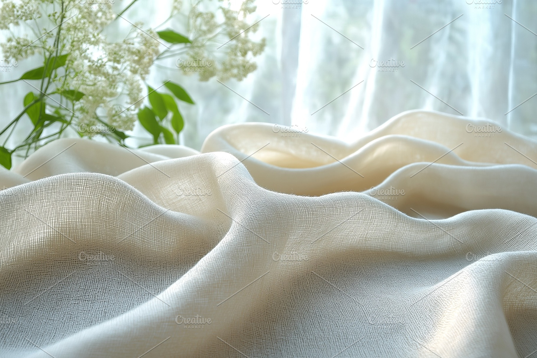 Soft, flowing cream-colored fabric draped elegantly with delicate white flowers, a Background Photo by ImageMir