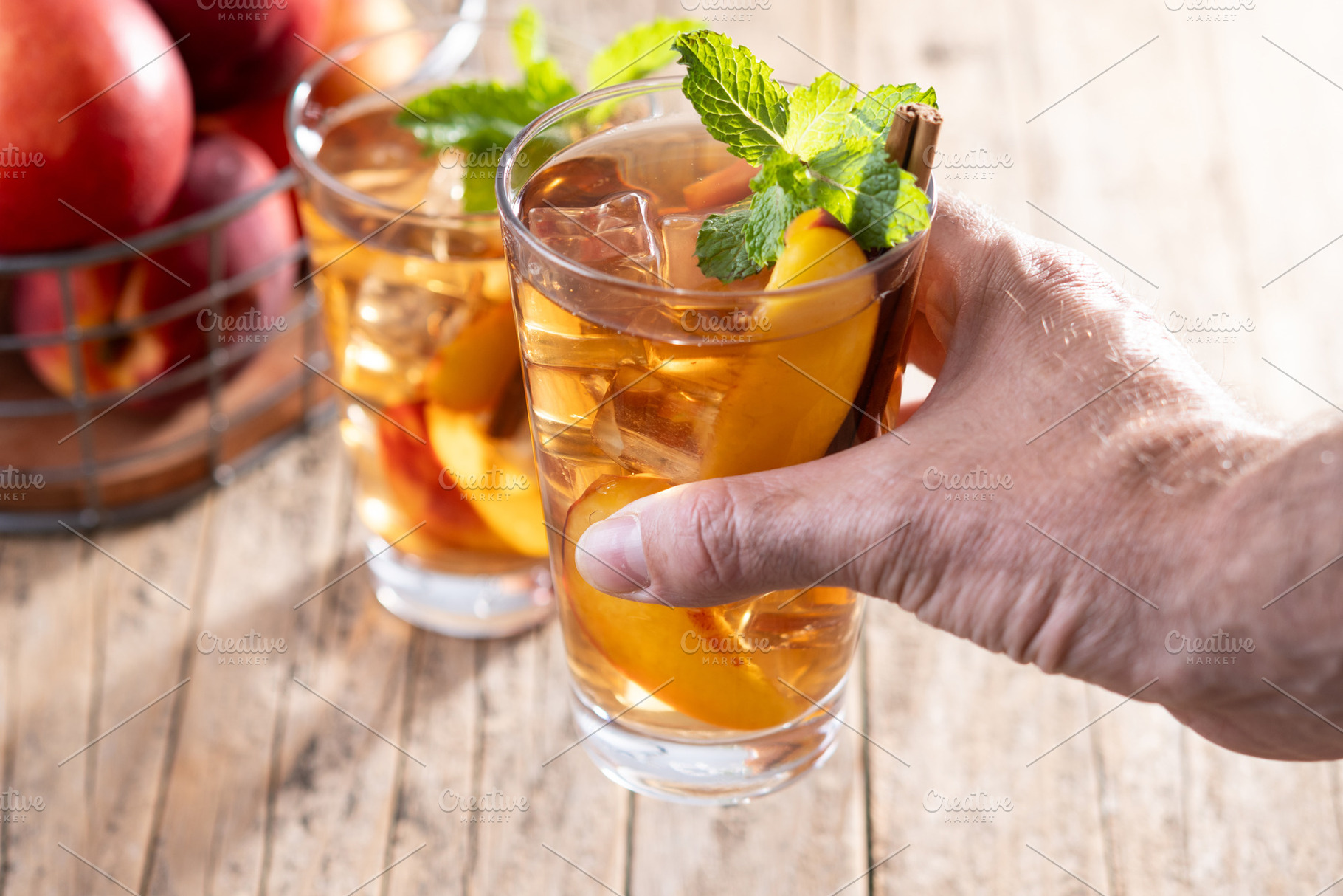 Refreshing peach iced tea in glass with ice cubes, a Food & Drink Photo by etorres69