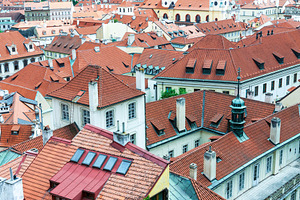 Red tiled roofs of Prague old town, an Architecture Photo by BOOCYS