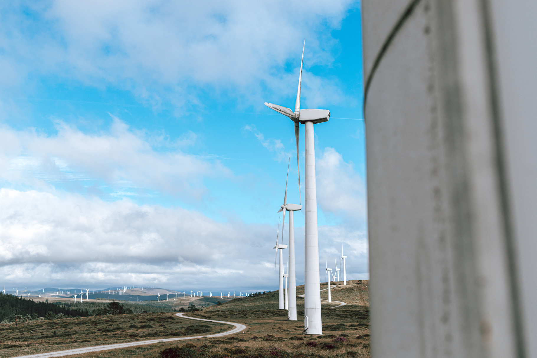 Wind turbines on an open field featuring wind turbine, wind, and ...